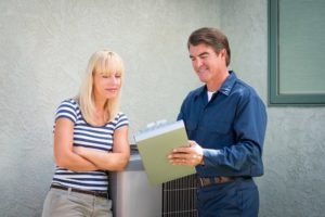 discussing HVAC filters with technician